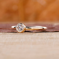 Handmade bezel engagement ring in yellow gold.

