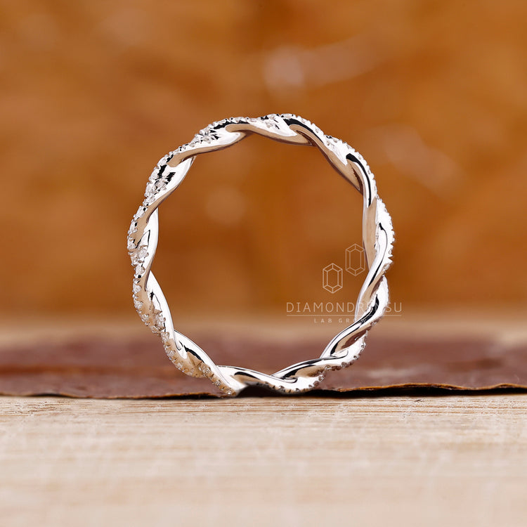 Twisted white gold wedding band.