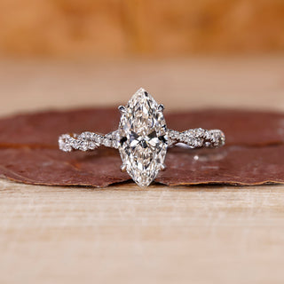 Hidden halo marquise diamond engagement ring in white gold.
