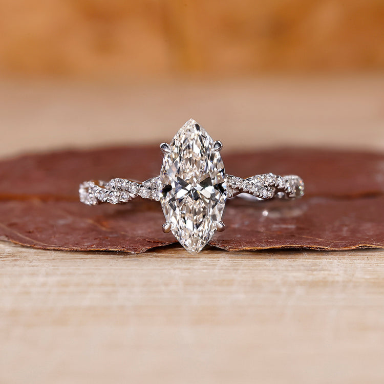 Hidden halo marquise diamond engagement ring in white gold.
