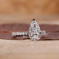IGI certified custom pear diamond ring in pave setting.
