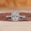 Elongated cushion cut diamond ring in white gold ring.
