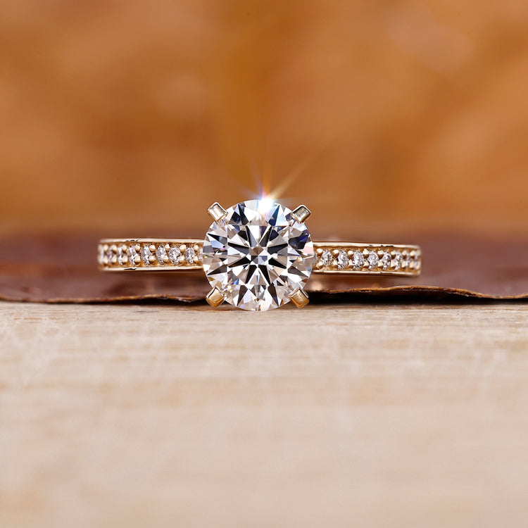 Yellow gold engagement ring with round diamond engagement ring.
