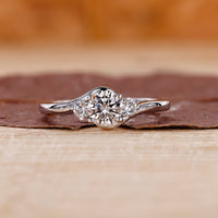 Three stone diamond engagement ring in white gold ring.
