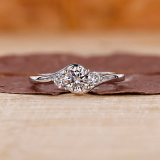 Three stone diamond engagement ring in white gold ring.
