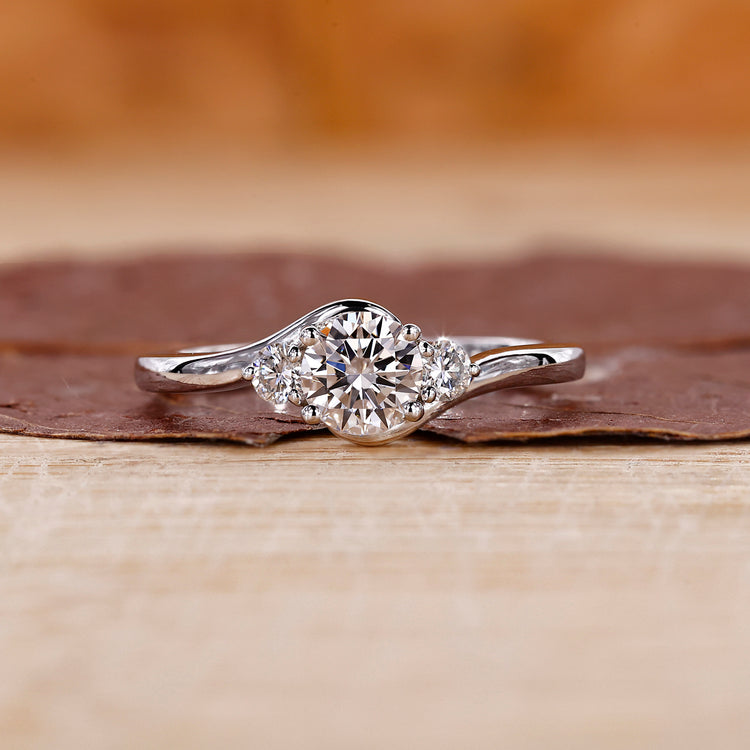 Three stone diamond engagement ring in white gold ring.
