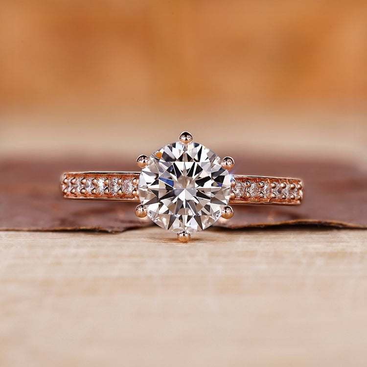 Rose gold diamond ring with round cut diamond ring.
