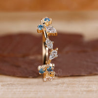 Yellow Gold Wedding Band featuring marquise cut diamonds.
