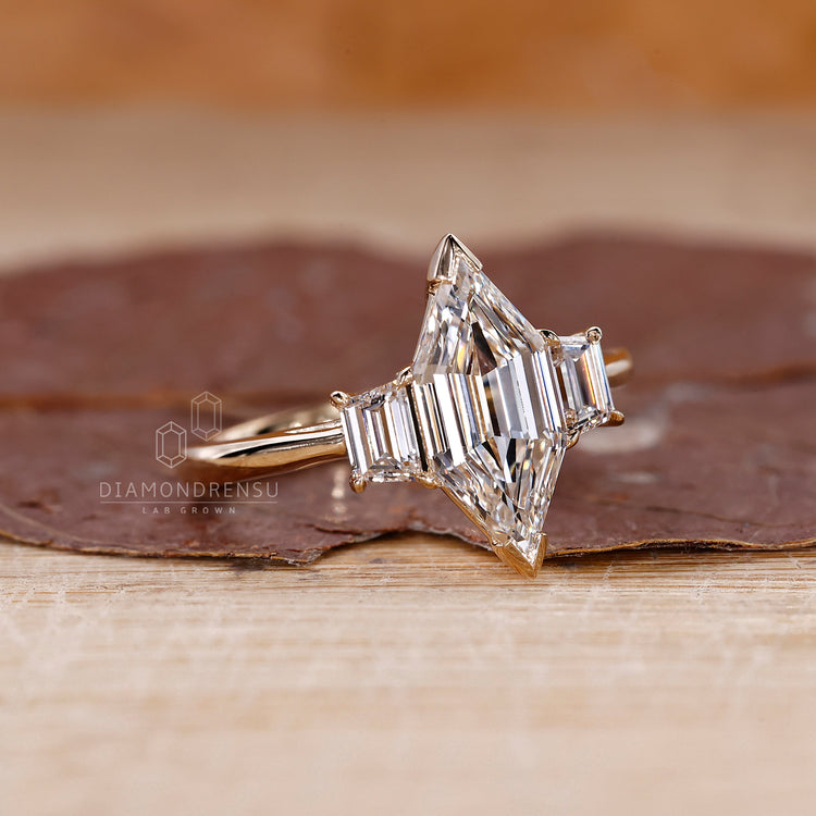 Hexagon step cut engagement ring fits v prong setting.
