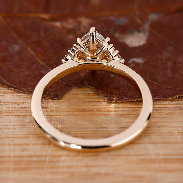 Custom marquise engagement ring with handcrafted gold band.
