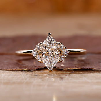 Dutch marquise solitaire diamond ring with 8 claw prong setting.
