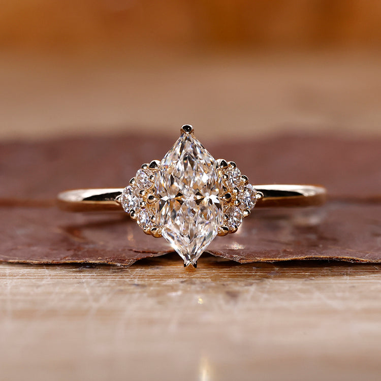 Dutch marquise solitaire diamond ring with 8 claw prong setting.
