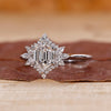 White gold engagement ring with hexagon step cut ring.
