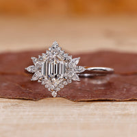 White gold engagement ring with hexagon step cut ring.
