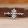 Marquise cut engagement ring in white gold.
