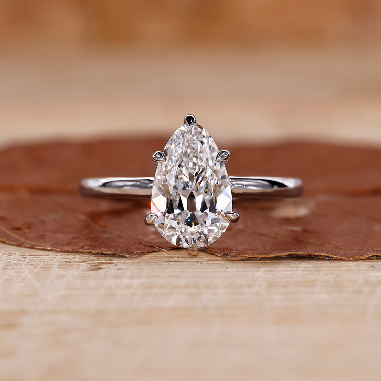 Pear solitaire engagement ring crafted in a 6 claw prong setting.
