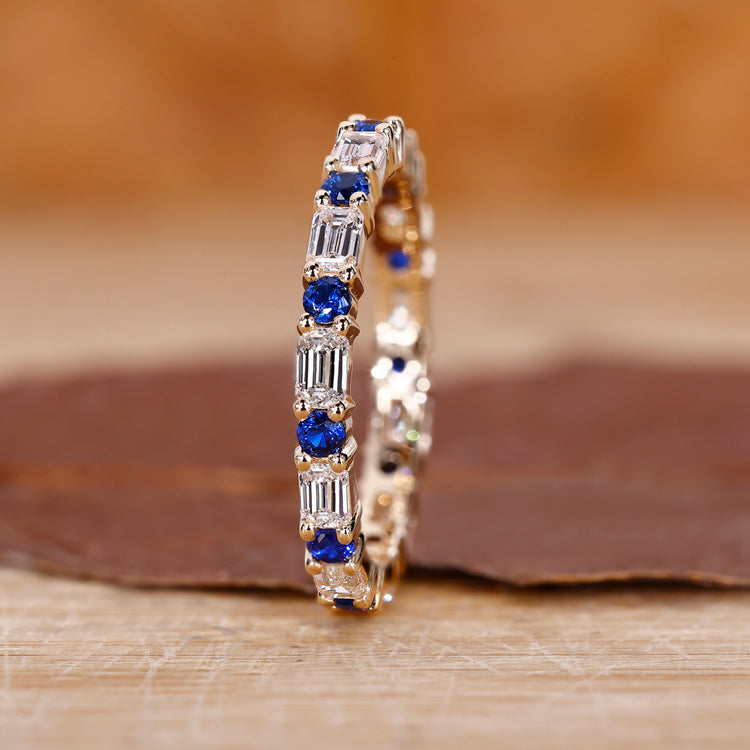 Emerald diamond wedding band in yellow gold.