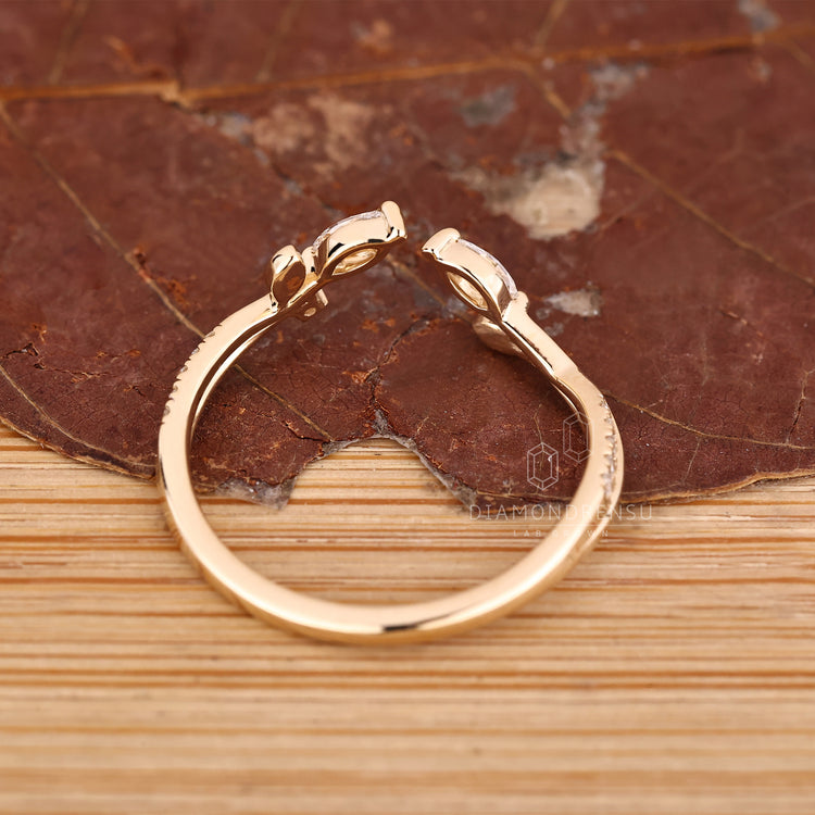 Lab grown diamond wedding band open gap style.