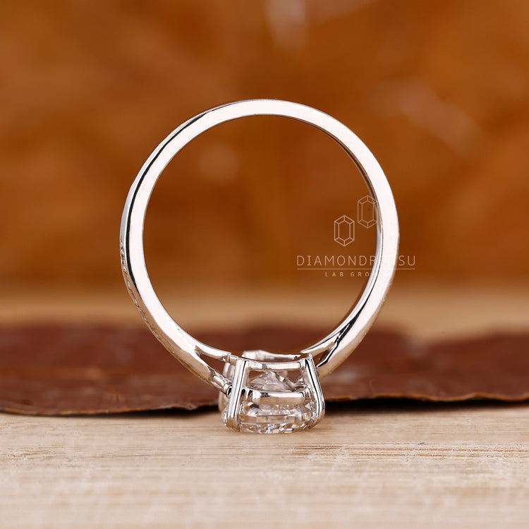 Coffin diamond ring round pave band pinch shank.
