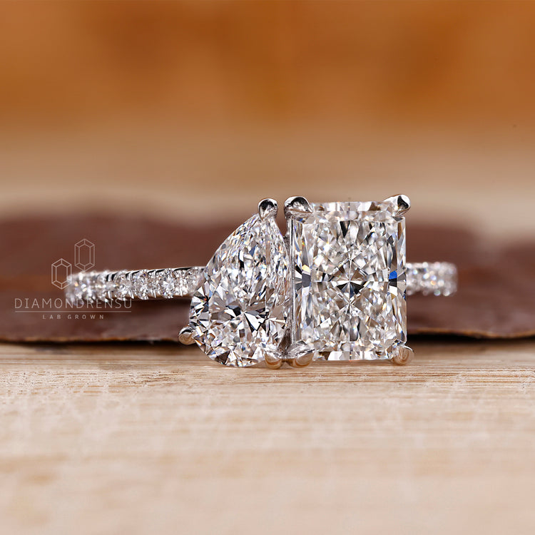 Pear radiant diamond ring pave band round diamond.
