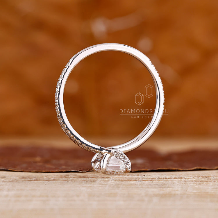 Emerald diamond ring pave band split shank style.
