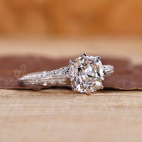 Cushion Old Mine Cut Ring with round diamonds.