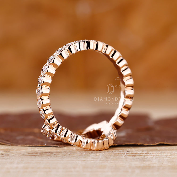 Elegant bezel diamond ring with pave accents.
