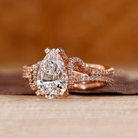 Lab grown pear diamond ring hidden halo pave style.
