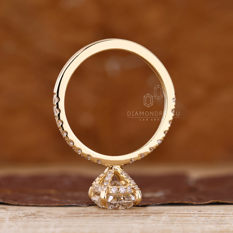 Oval diamond ring pave hidden halo round diamond.
