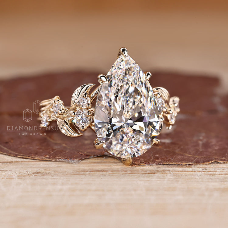 Pear Cut Diamond Engagement Ring round side stones.
