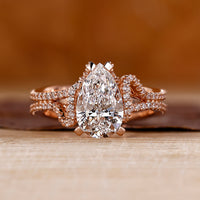 Pear cut diamond ring hidden halo double row pave set.
