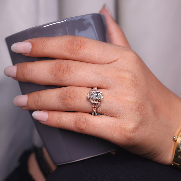 Pear cut ring double row pave hidden halo prong set.
