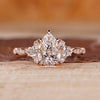 Pear cut diamond ring cluster muse marquise pave style.