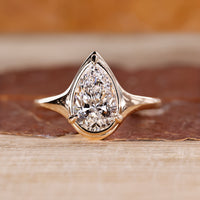 Pear cut diamond ring bezel prong solitaire style.
