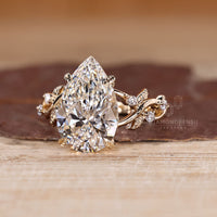 Pear Cut Diamond Ring cluster setting with side stones.
