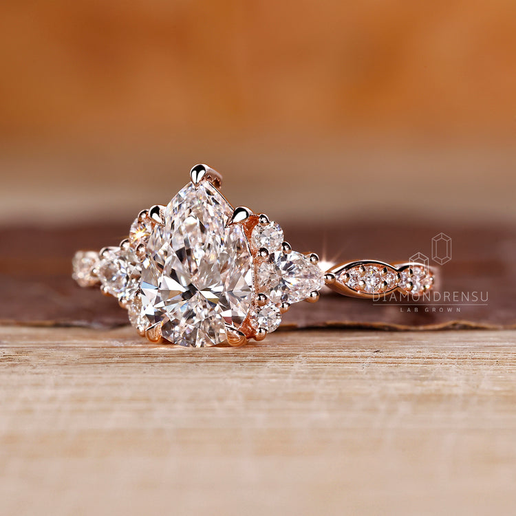 Lab grown pear diamond ring cluster marquise pave.