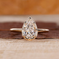 Pear cut diamond ring solitaire eight claw vintage.
