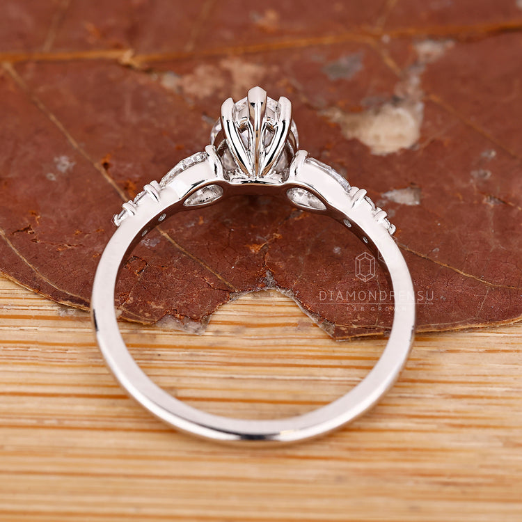 IGI certified pear diamond ring v prong setting.
