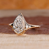 Lab grown pear diamond ring bezel prong solitaire.
