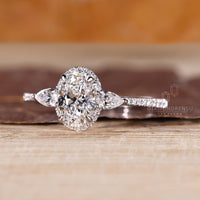 Pave setting oval diamond ring with tapered shank.
