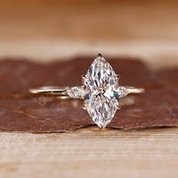 Three stone marquise diamond ring cathedral prong set.
