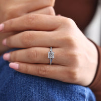 Princess cut ring cathedral split shank four prong set.
