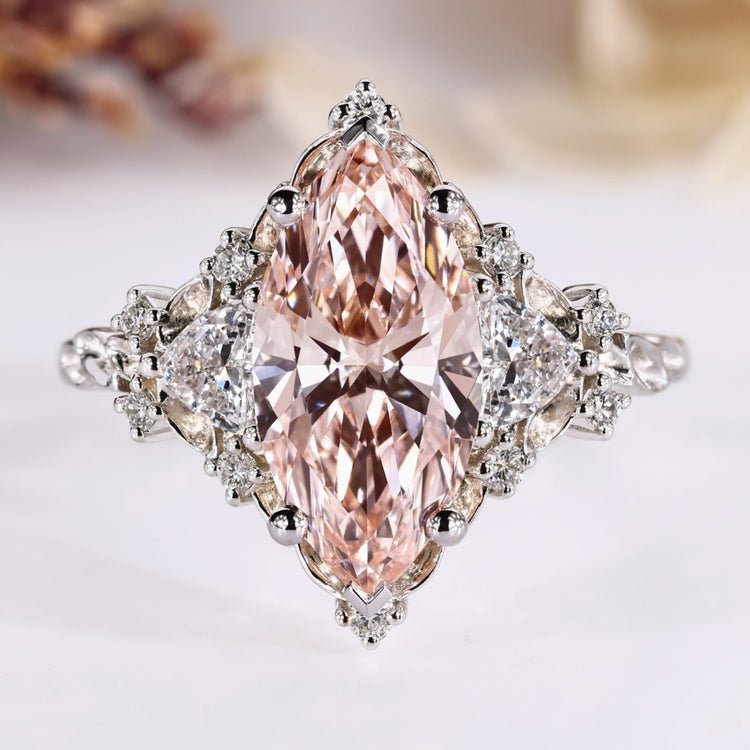 Marquise cut diamond ring with pink diamond centre.