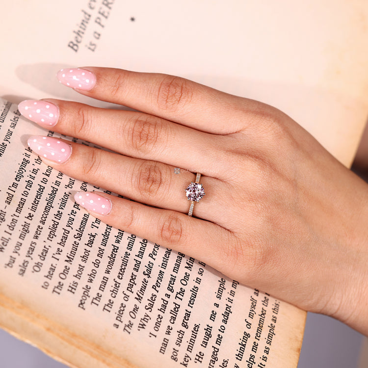 Round diamond ring with small round diamonds.