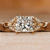 Princess cut diamond ring with round side stones.