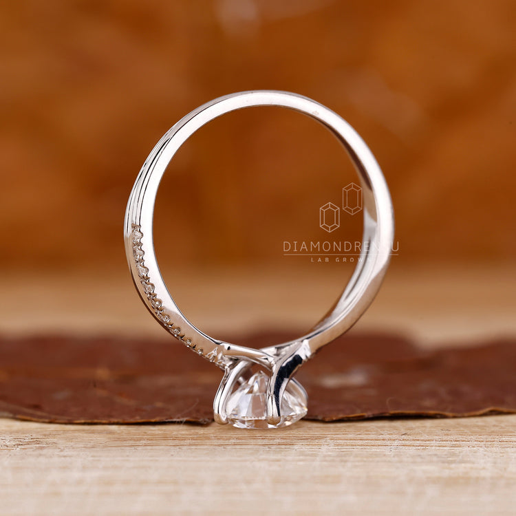 Round diamond ring twisted shank three prong set.
