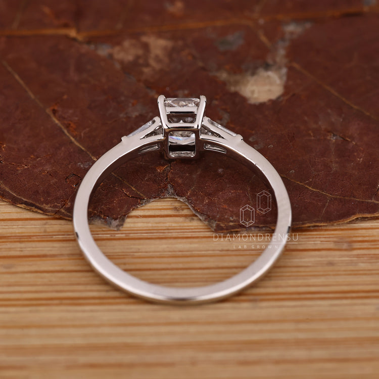 IGI certified radiant diamond ring three stone set.
