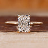 Radiant cut diamond engagement ring with round hidden halo.