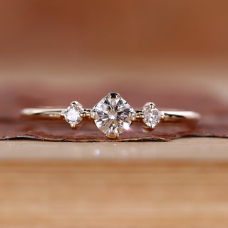 Round cut diamond ring minimalist three stone style.