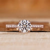 Round cut diamond ring with round diamond pave style.
